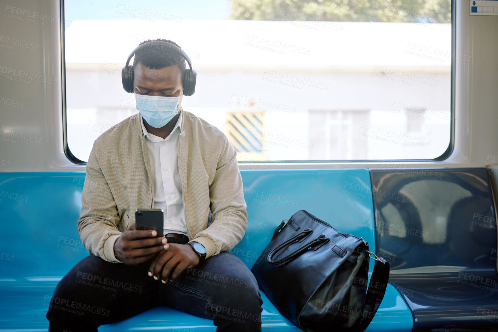 Buy stock photo Travel, headphones and businessman on train with mask for public transport, journey and trip to work. Passenger, professional and person with music and smartphone on subway, metro railway and commute