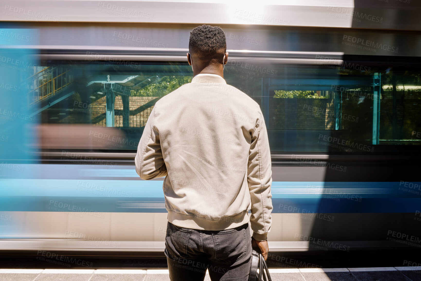 Buy stock photo Back, black man and train with luggage for commute, urban travel and morning journey of metro transport. Male person, vehicle and suitcase with waiting arrival, railway station and platform departure