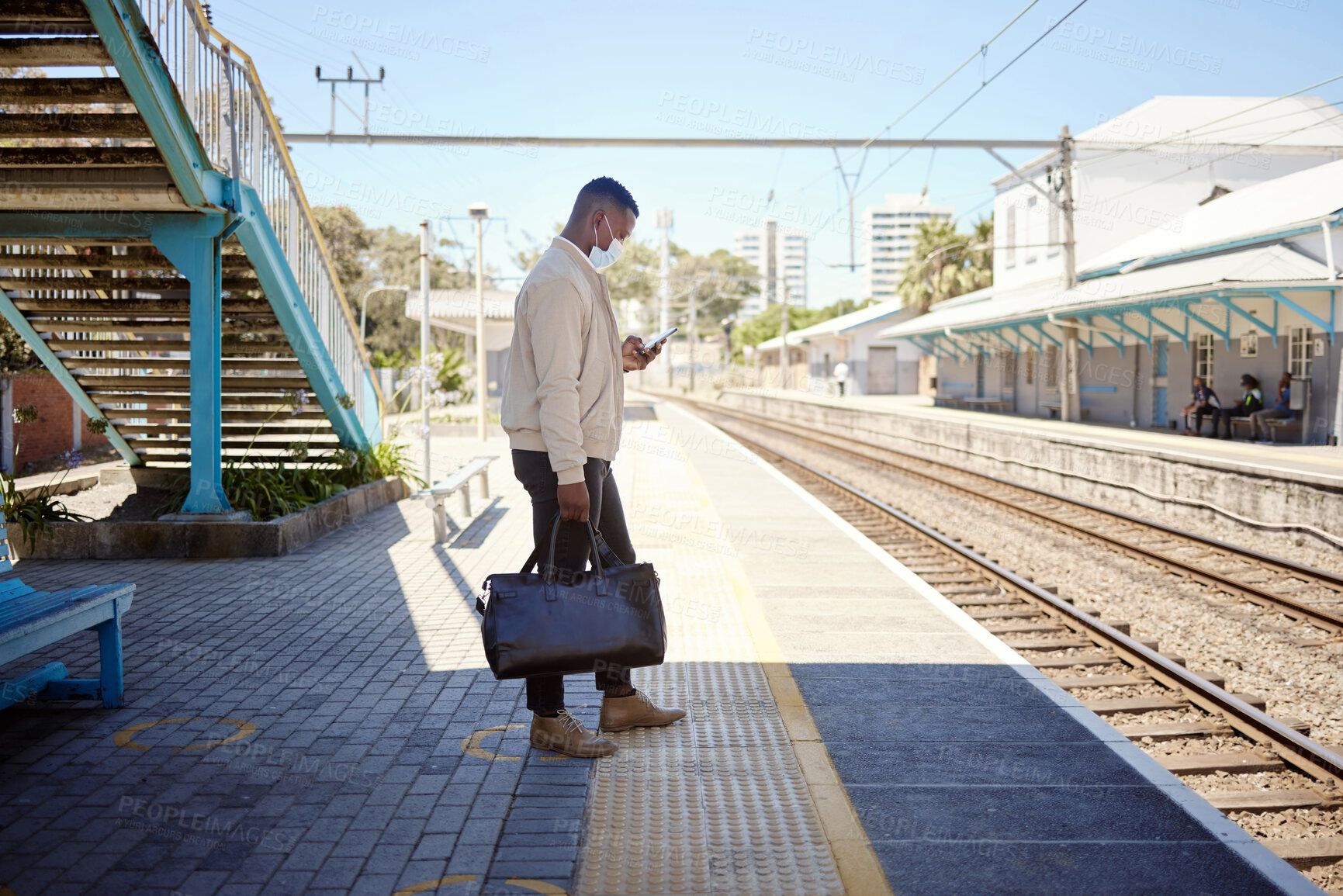 Buy stock photo Business, black man and check phone for travel with train schedule, metro commute and waiting on transport. Male person, mobile and communication with luggage, morning journey and location for delay