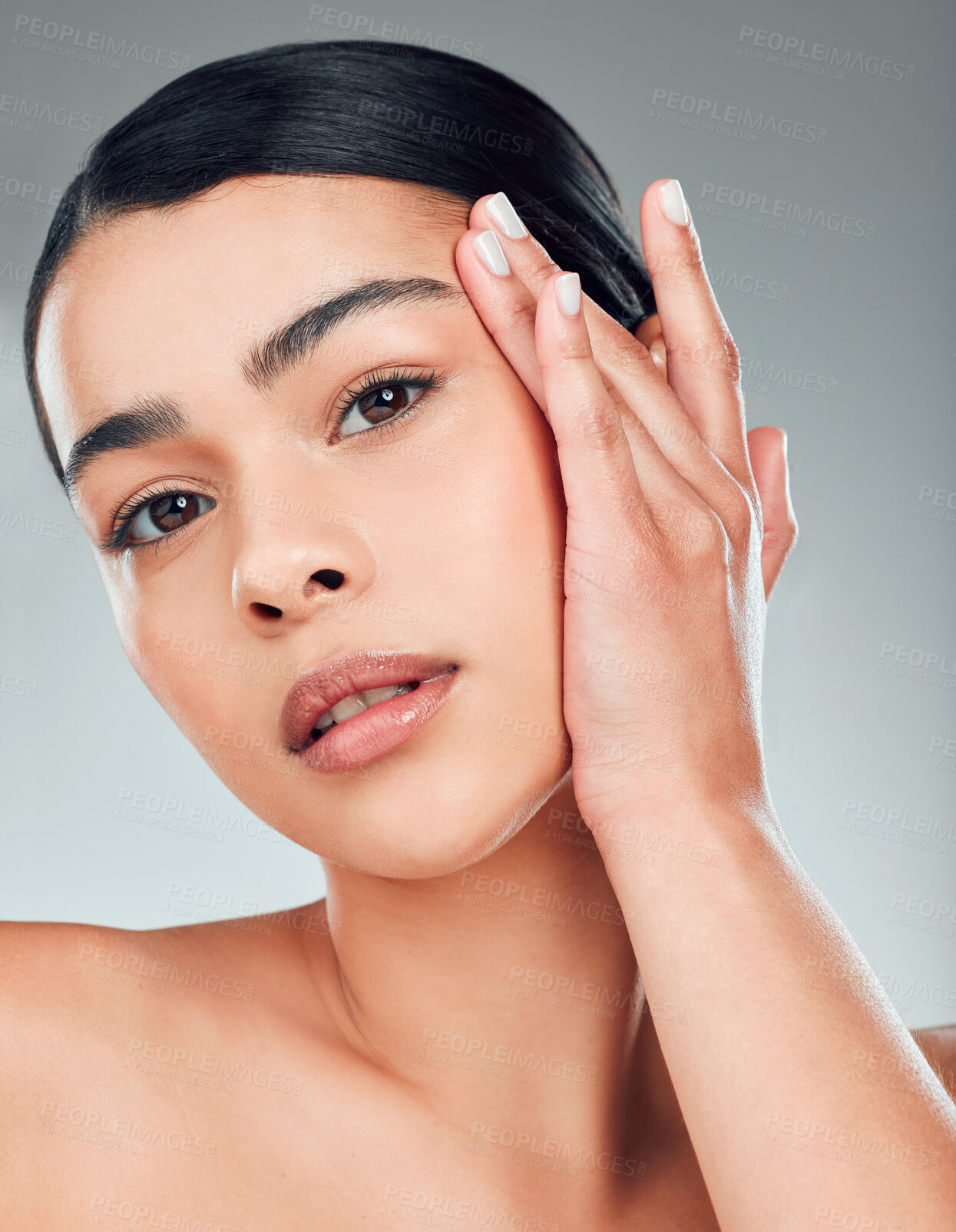 Buy stock photo Skincare, hand and portrait of woman in studio with hydration, collagen or facial routine. Natural, healthy glow and female person from Puerto Rico with face dermatology treatment by gray background.