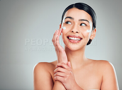 Buy stock photo Face cream, mockup and woman with skincare in studio with nourishment, hydration and glow. Happy, health and female person with facial moisturizer for beauty dermatology routine by gray background.