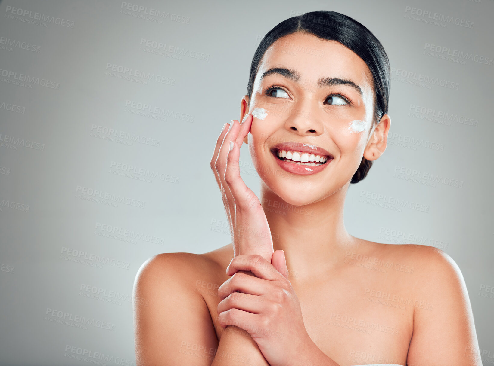 Buy stock photo Face cream, mockup and woman with skincare in studio with nourishment, hydration and glow. Happy, health and female person with facial moisturizer for beauty dermatology routine by gray background.