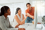 Young hispanic call centre telemarketing agent training new assistants on a computer in an office. Team leader troubleshooting solution with interns for customer service and sales support. Colleagues operating helpdesk together