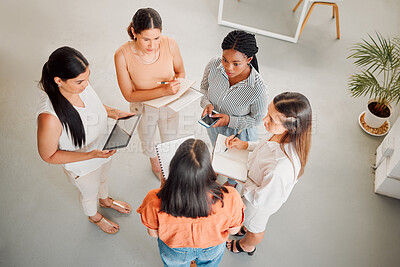 Buy stock photo Business women, meeting and discussion with team above for design, project or company mission at office. Top view, group or female people working on strategy, ideas or collaboration at workplace