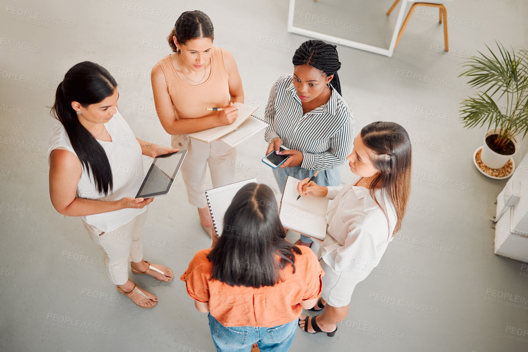 Buy stock photo Business women, meeting and discussion with team above for design, project or company mission at office. Top view, group or female people working on strategy, ideas or collaboration at workplace