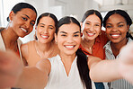 Portrait of a diverse group of five happy businesswomen taking a selfie together at work. Cheerful businesspeople taking a photo in an office. Women working in corporate taking a picture