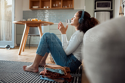 Buy stock photo Woman, headphones and home with music, chores break and morning on floor with rest in living room. Audio, coffee and hot drink with listening, podcast and home cleaning on relax weekend in break