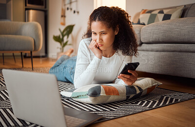 Buy stock photo Woman, phone and watching on laptop in home, streaming movie and check text message on floor. Female person, relax and online for subscription entertainment, communication and weekend for series