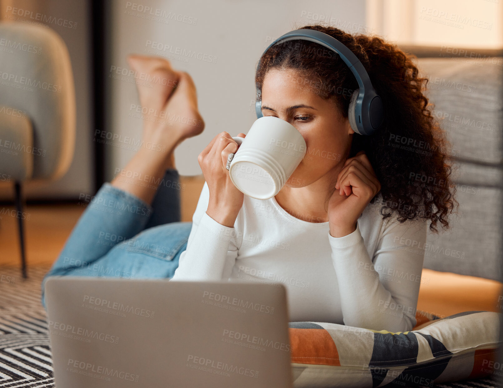 Buy stock photo Woman, headphones and home with laptop, music and morning on floor with rest in living room. Video, coffee and hot drink with listening, streaming and internet search on relax weekend on break