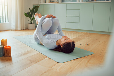 Buy stock photo Woman, stretching and knees on floor in home with yoga, breathing and mindfulness in morning. Girl, person and apanasana pose for wellness, health and circulation with peace, balance and exercise mat