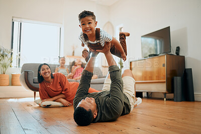 Buy stock photo Bonding, airplane and lifting with family on floor for love, playful game and happiness. Care, support and laughing with child and parents in living room at home for silly, comedy and funny
