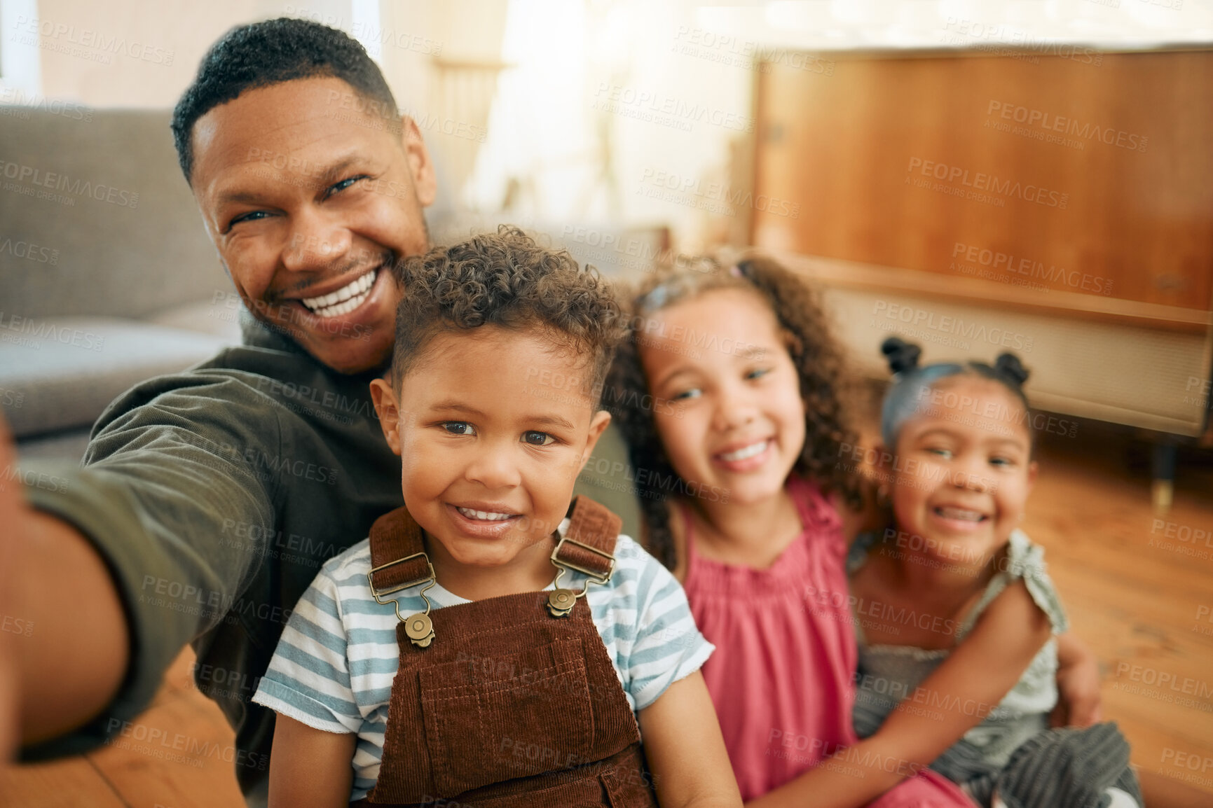 Buy stock photo Father, selfie and children on floor with hug, smile and care with bonding, love and photography at family house. Dad, man and kids with profile picture, excited and relax with post on social media