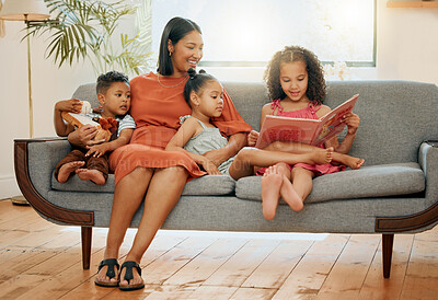 Buy stock photo Reading, book and relax with family on sofa for love, fairytale and happiness together. Care, storytelling and fantasy with mother and children in living room at home for bonding, smile and learning