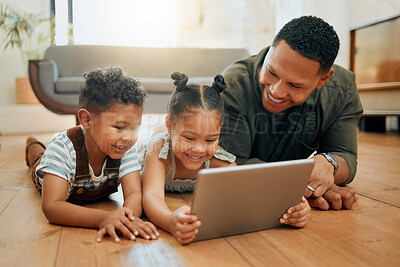 Buy stock photo Dad, children and tablet on floor in home for playing games, watching online cartoons and bonding together. Man, happy kids and digital tech in lounge with movie entertainment on streaming service