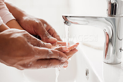 Buy stock photo Parent, kid and washing of hands in bathroom for teaching healthy habits, hygiene support and disinfection in home. People, water and soap for dirt, bacteria prevention or cleaning routine by basin