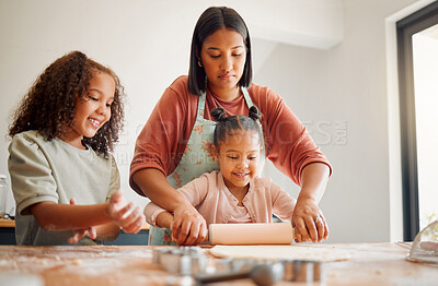 Buy stock photo Happy, baking and kids with mom help in kitchen with dough, cooking and youth learning in home. Girl, cookie and breakfast with care, support and rolling pin with culinary development and love