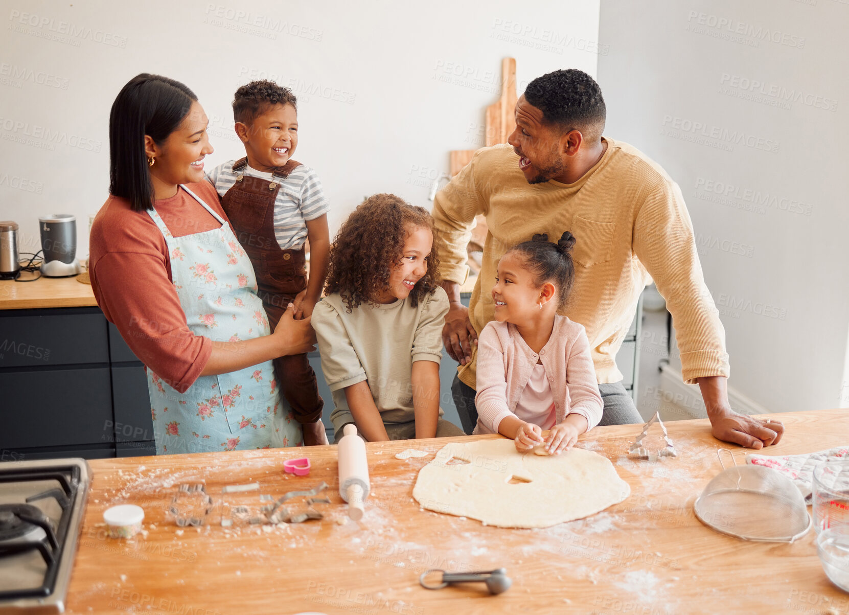 Buy stock photo Family, happy and baking with kids in home for love, support and teaching cookie recipe on weekend. Father, mother and smile with children in kitchen for ingredients, preparation and learning to cook