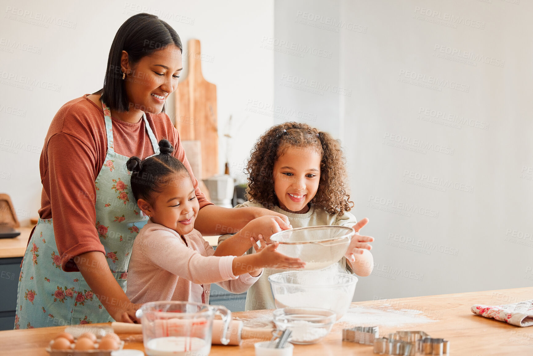 Buy stock photo Happy, mother and cooking with children in kitchen for help, support or parent teaching recipe. Siblings, woman and flour with kids at home for ingredients, preparation or learning to bake on weekend