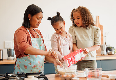 Buy stock photo Children, woman and help with baking in kitchen for support, development and learning cooking recipe. Family, mother and kids pouring flour in bowl on table for ingredients, preparation and teaching