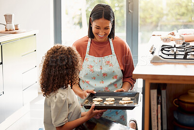 Buy stock photo Mother, child and baking of cookies by stove for cake recipe, dessert snack or bonding in kitchen. Happy family, woman and girl in home with biscuits in pan and cooking sweet treat with love or smile