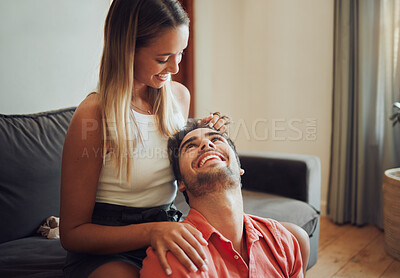 Buy stock photo Happy, couple and caressing hair, home and massaging of head, love and people on date in living room. Relax, hairdresser and treatment for haircare, smile and romance in lounge, woman and break