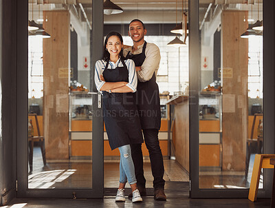 Buy stock photo Portrait, happy and couple at door of cafe with confidence, woman or small business owners together. Arms crossed, teamwork or managers at coffee shop entrance with hospitality service in partnership