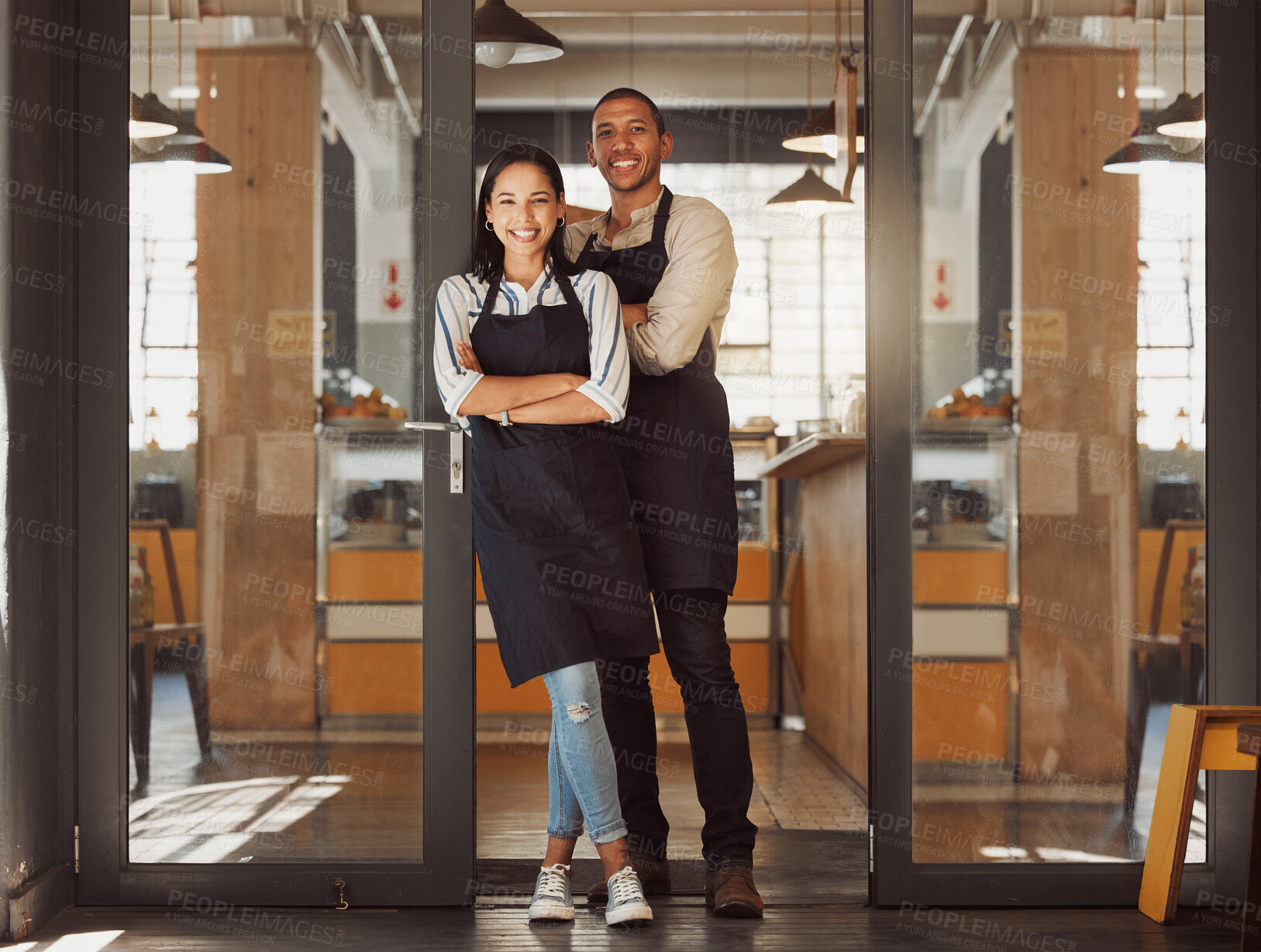 Buy stock photo Portrait, happy and couple at door of cafe with confidence, woman or small business owners together. Arms crossed, teamwork or managers at coffee shop entrance with hospitality service in partnership