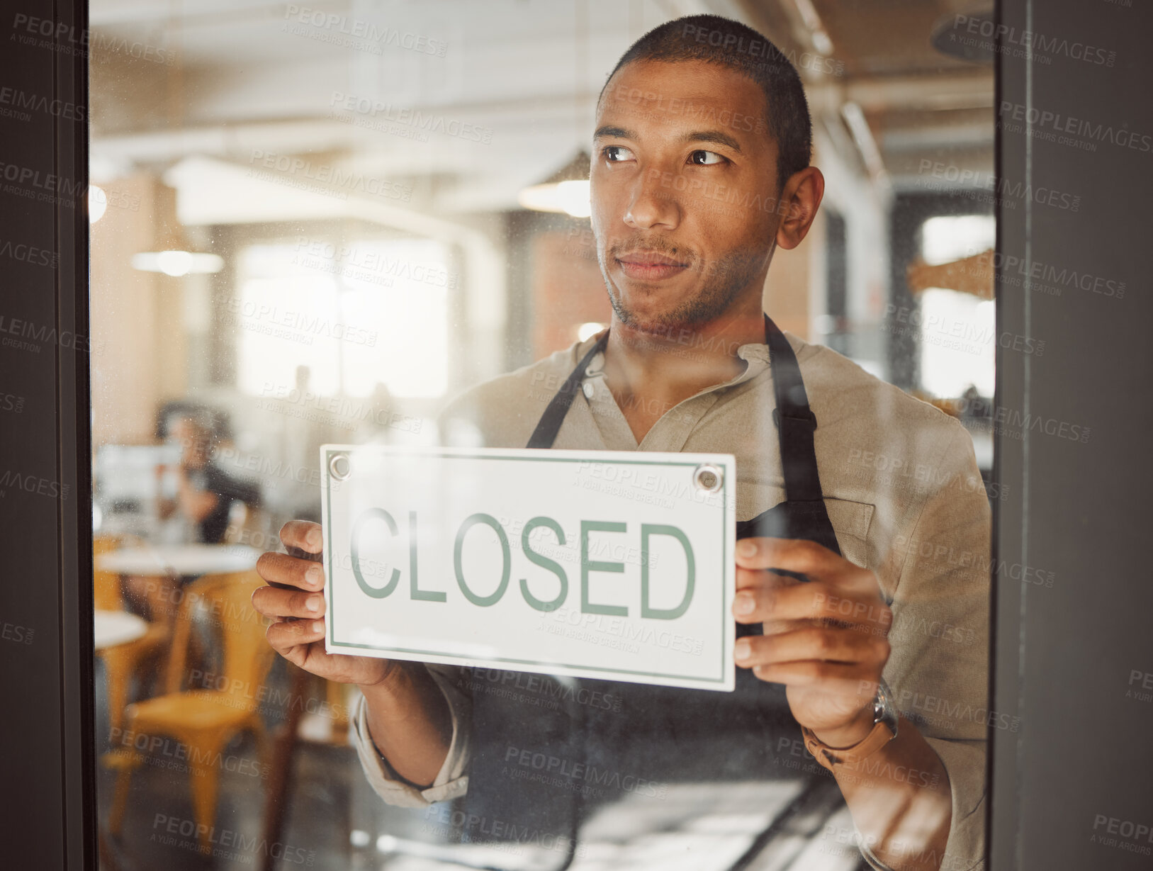 Buy stock photo Man, window and business owner with closed sign for cafe announcement, financial crisis and end of trading hours. Thinking, male waiter and poster with retail news, service information and bankruptcy