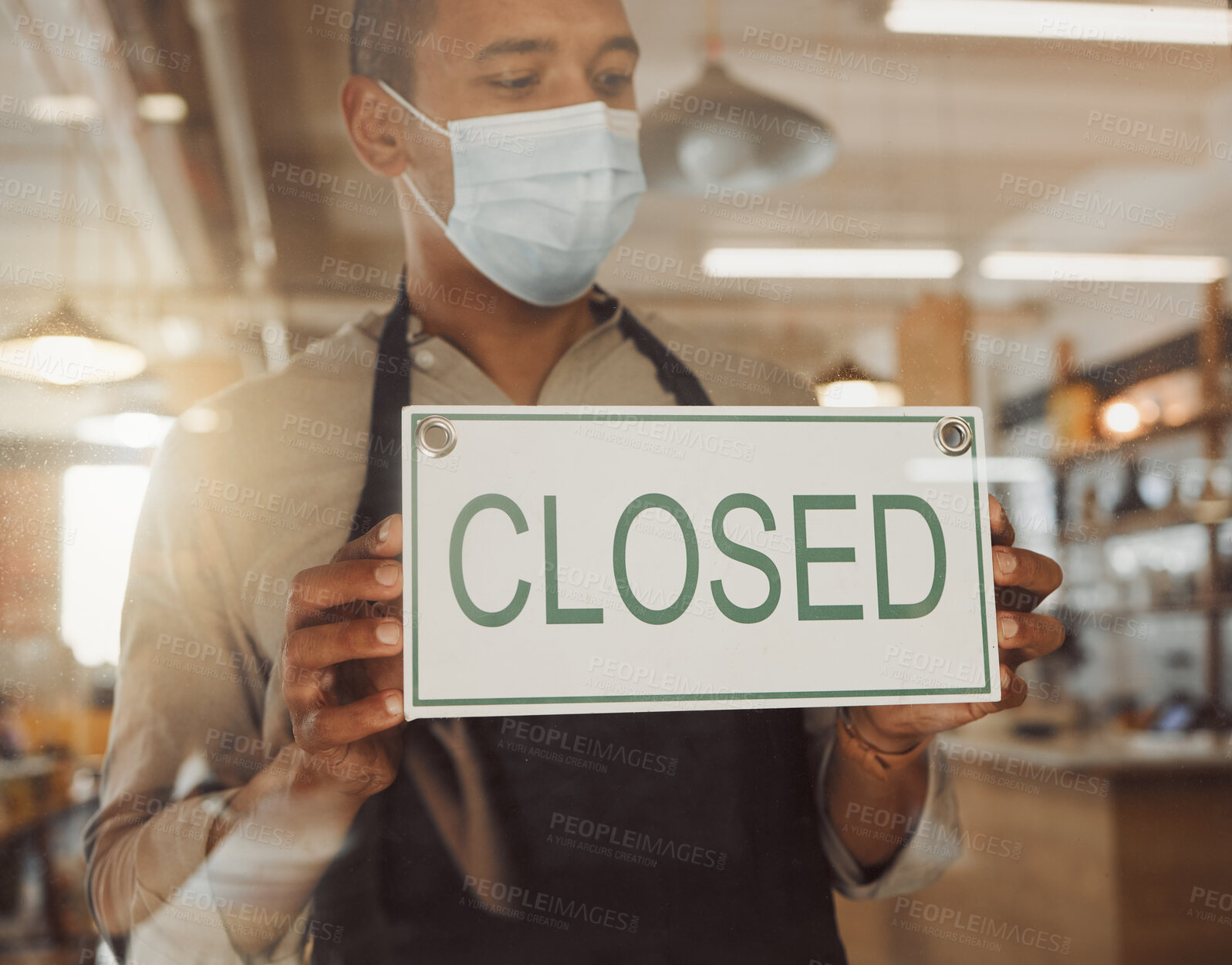 Buy stock photo Closed, sign and man by window of cafe for announcement, information and notice of cleaning time. Entrance, waiter and small business for communication, odor control or update at restaurant with mask