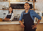 Two business partners together in their coffeeshop. Young couple collaborate in the kitchen of their cafe. Portrait of colleagues together in their restaurant. Coworker with his partner in their shop