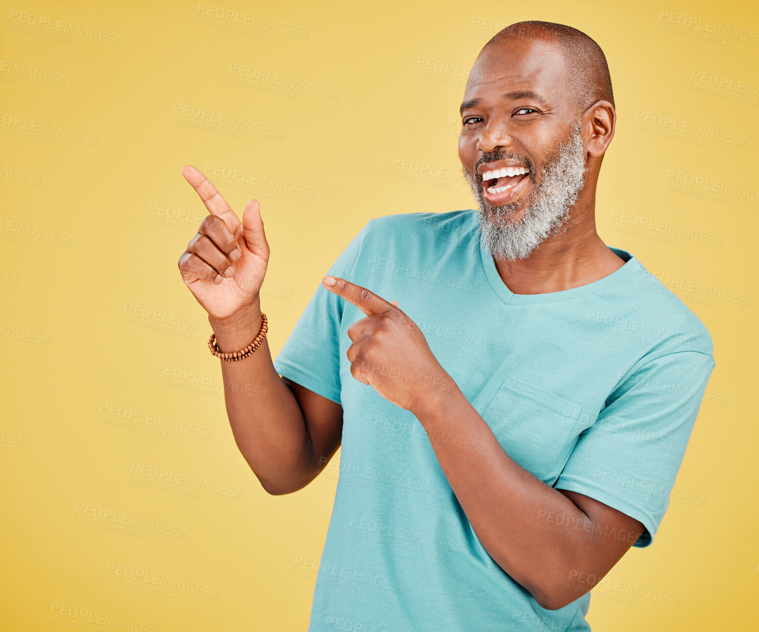 Buy stock photo Black man, smile and pointing in studio with portrait, offer or promotion selection. Mature person, happy or show gesture on yellow background space for deal, opinion or vote decision or announcement