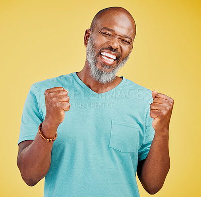 Buy stock photo Deal, fist pump and winner with mature black man in studio isolated on yellow background for celebration. Excited, motivation and success with happy senior person cheering for bonus, goals or target