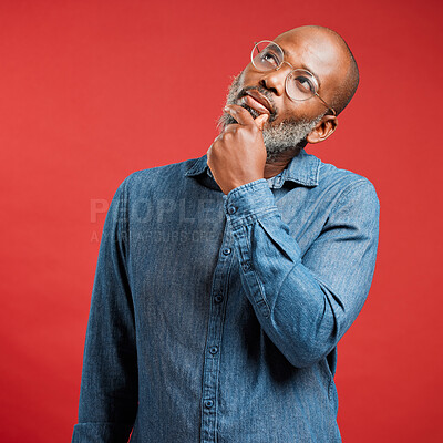 Buy stock photo Thinking, ideas and mature black man in studio with memory, professional or business decision. Remember, glasses and creative designer with brainstorming, planning or opinion choice on red background