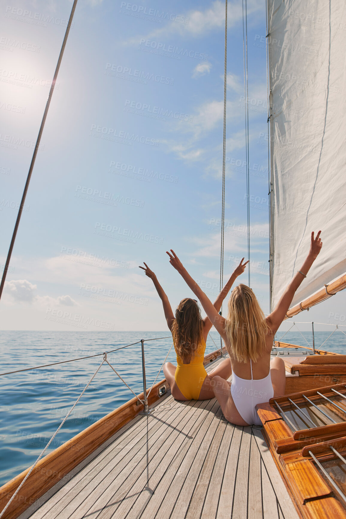 Buy stock photo Friends, girls or travel for holiday on yacht with freedom, peace sign or summer celebration. Back, adventure or arms raised in boat for vacation cruise, tropical island or bonding together in bikini