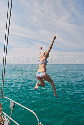 Buy stock photo Woman, boat and jumping in water on holiday for outdoor adventure, and freedom in summer. Tropical vacation, travel and female person with bikini by ocean for swimming, tourism and weekend getaway