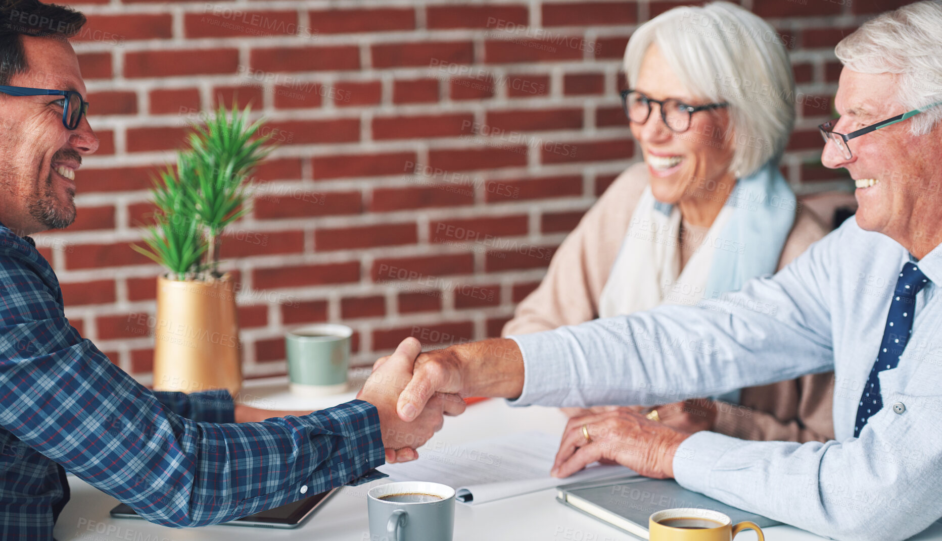 Buy stock photo Senior, couple and handshake with consultation in meeting for retirement planning success or mortgage deal. People, financial advisor and shaking hands with client for legal investment and thank you