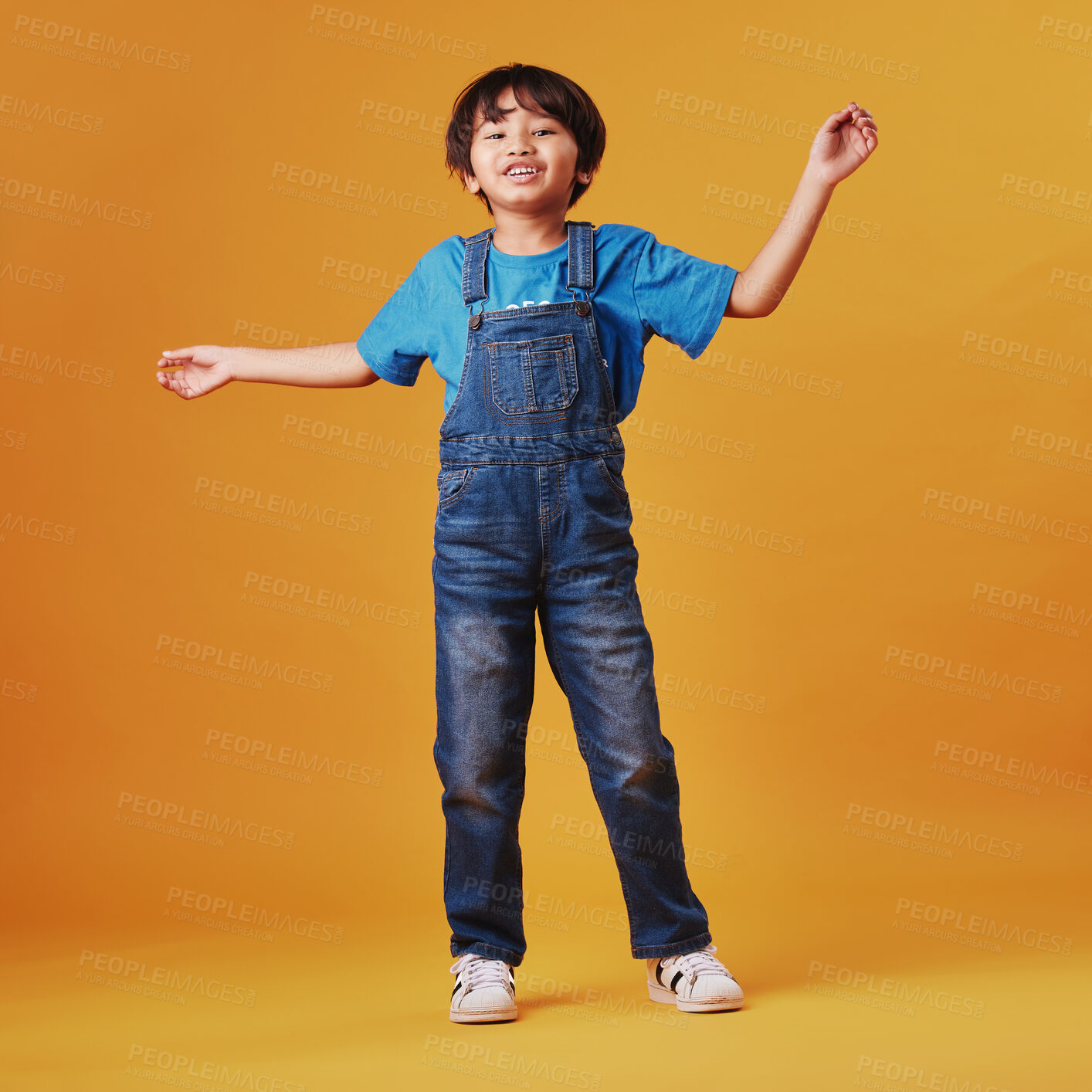 Buy stock photo Japanese kid, boy and happy in studio background for fashion with fun, outfit and swag in Japan. Male person, child and smile or satisfied on portrait in confidence with trendy clothes and style