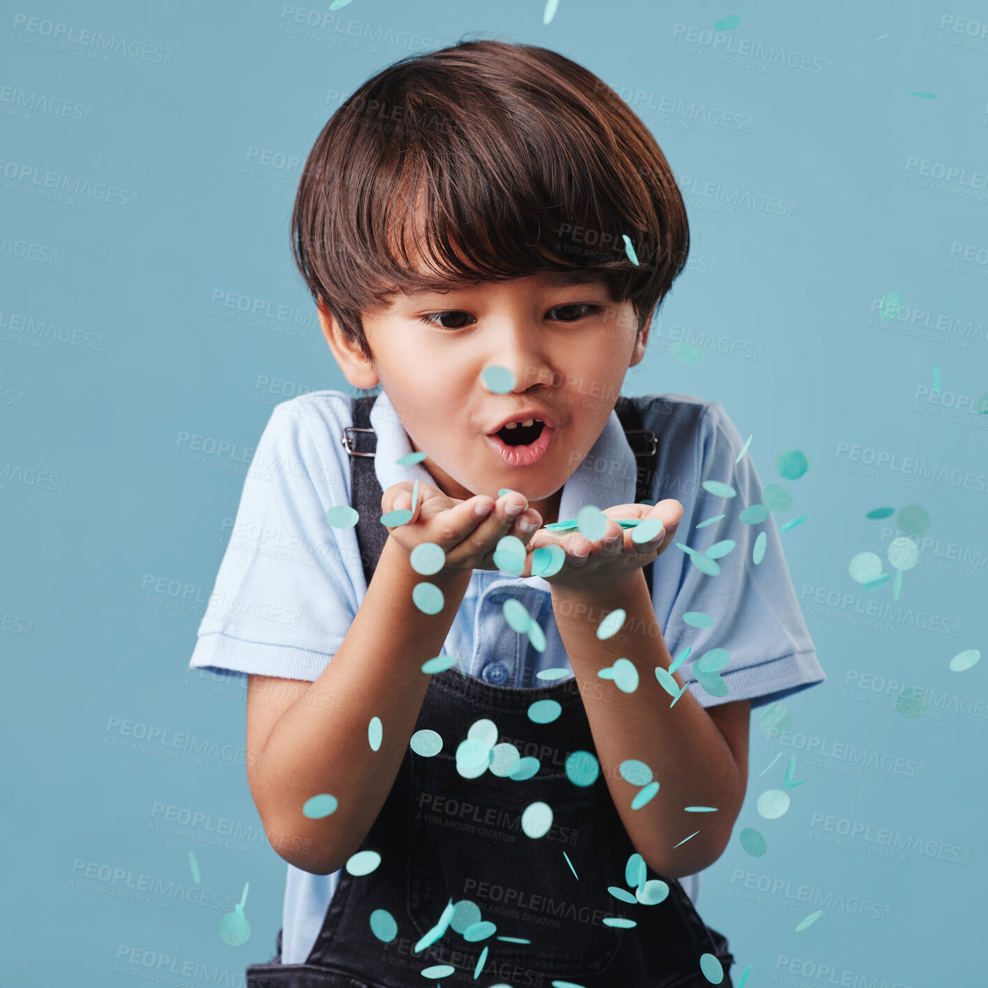 Buy stock photo Asian kid, boy and blowing confetti with happiness, celebration and joy on blue studio background. Model, excited and childhood with glitter, gender reveal and emotions with fun, playful and cute
