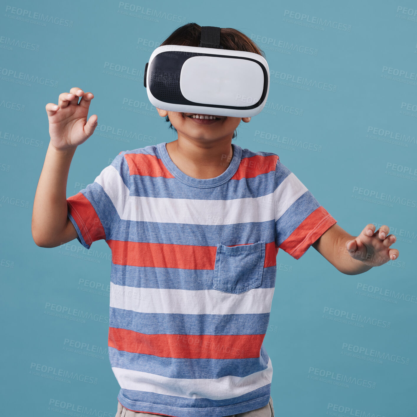 Buy stock photo Boy, vr headset and playing games in studio, streaming online and cyber interaction. Male person, entertainment and goggles for virtual world, blue background and connection for user experience