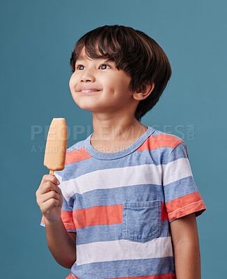 Buy stock photo Japanese boy, happy and popsicle in studio background with sweet snack or sucker in Japan. Male person, kid and smile in thinking with unhealthy food, dessert and treat with candy or ice cream