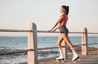 Buy stock photo Summer, roller skate and black woman at beach promenade for fitness freedom, fun exercise and hobby training. Relax, calm and sunshine nature with young skating culture, cool urban girl and sea youth