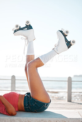 Buy stock photo Fun, roller skates and beach vacation in summer with woman enjoying hobby, relax and freedom while skating. Legs and shoes of a female skater being fit and active while at sea for leisure and travel