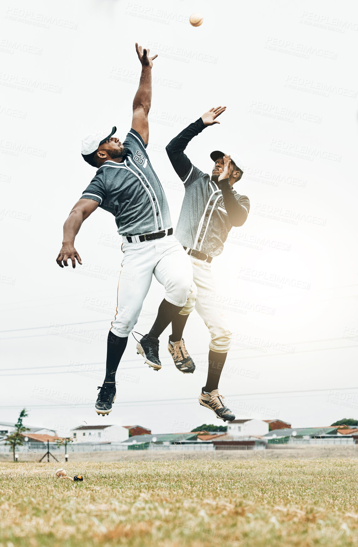 Buy stock photo Baseball player, jump and catch baseball in game, contest or  sport on field for sunshine. Team, teamwork and hands for ball in air at stadium, arena or pitch for sports, fitness and win outdoor