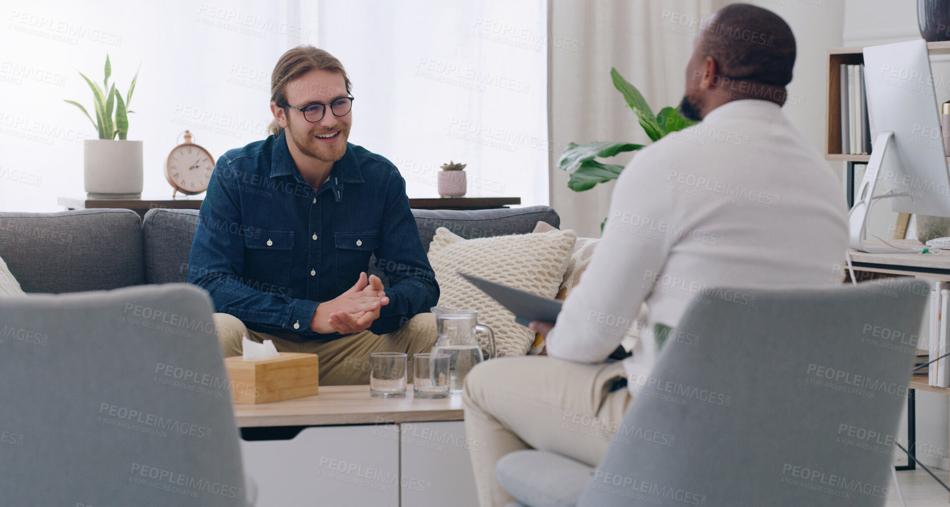 Buy stock photo Black man, talking psychologist and patient on mental health support sofa, anxiety consulting or depression counseling. Smile, happy and trust in psychology counselling therapy or rehabilitation help