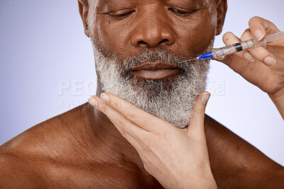 Buy stock photo Senior man and needle for skincare, collagen injection and face lift on grey studio background. Plastic surgery, black male and relax for wellness, anti aging and toned skin for facial muscles