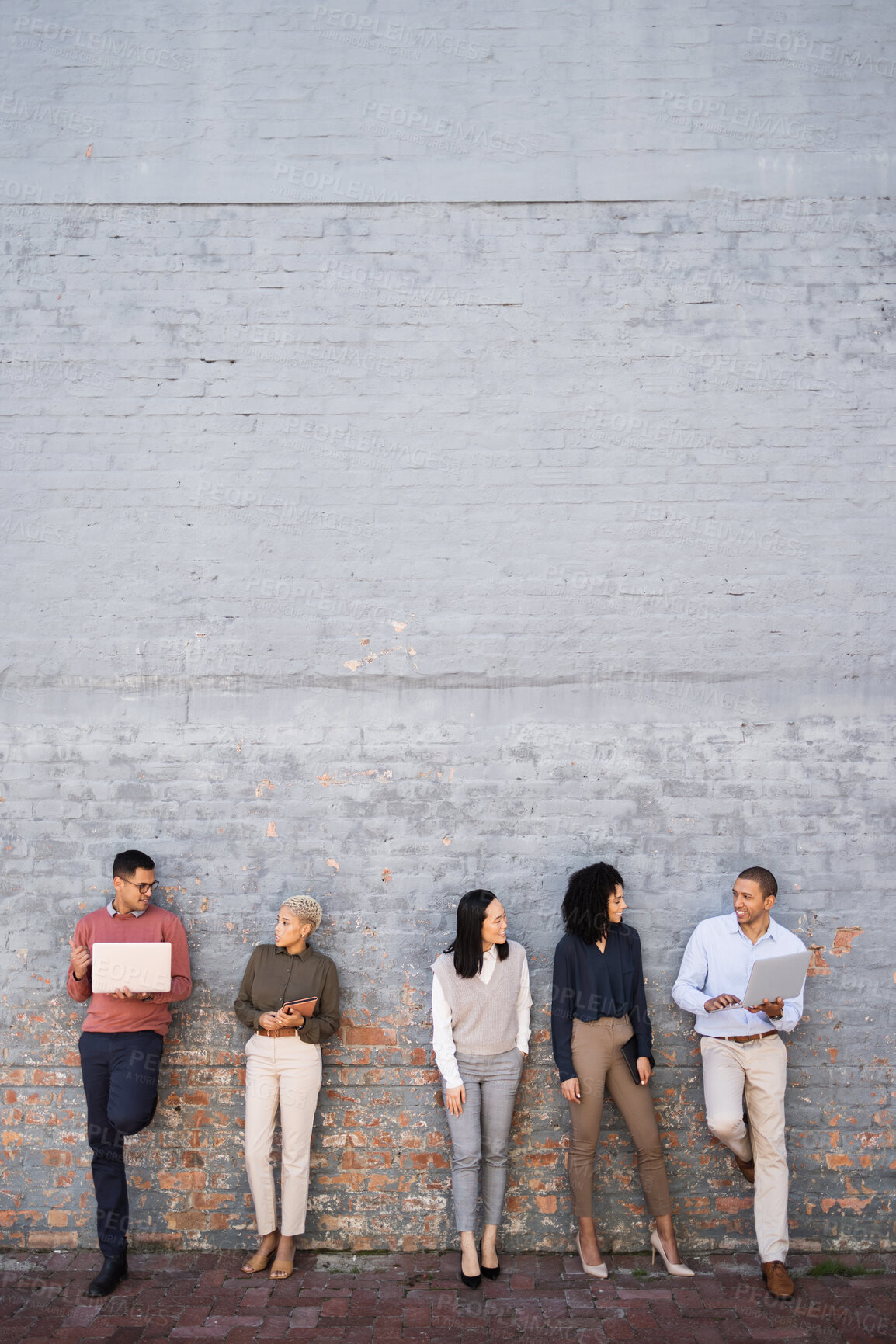 Buy stock photo Diversity, business people talking and standing outdoor with technology for wall mockup, happy conversation and interview meeting. Team, online communication and speaking together for hr recruitment