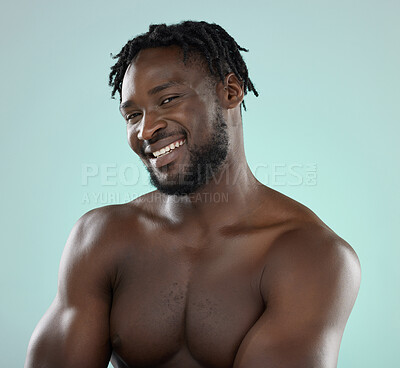 Buy stock photo Happy man, skincare and face portrait with a smile for beauty, hygiene and grooming in studio. Healthy black person on blue background for facial glow, clean skin and self care with dermatology 