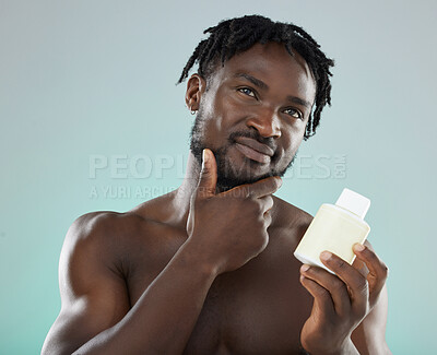 Buy stock photo Skincare, black man and cream for cosmetics, wellness and natural beauty with guy on grey studio background. African American male, confident person and gentleman with lotion for smooth or clear skin