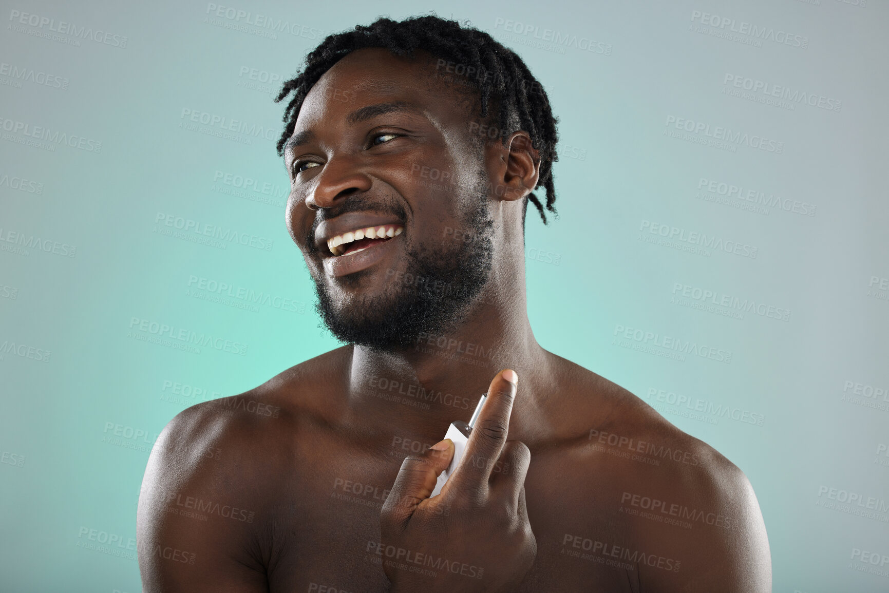 Buy stock photo Thinking, cologne and blue background with a model black man posing shirtless in studio for body spray. Perfume, product or skin with a handsome, muscular and young male standing topless on space