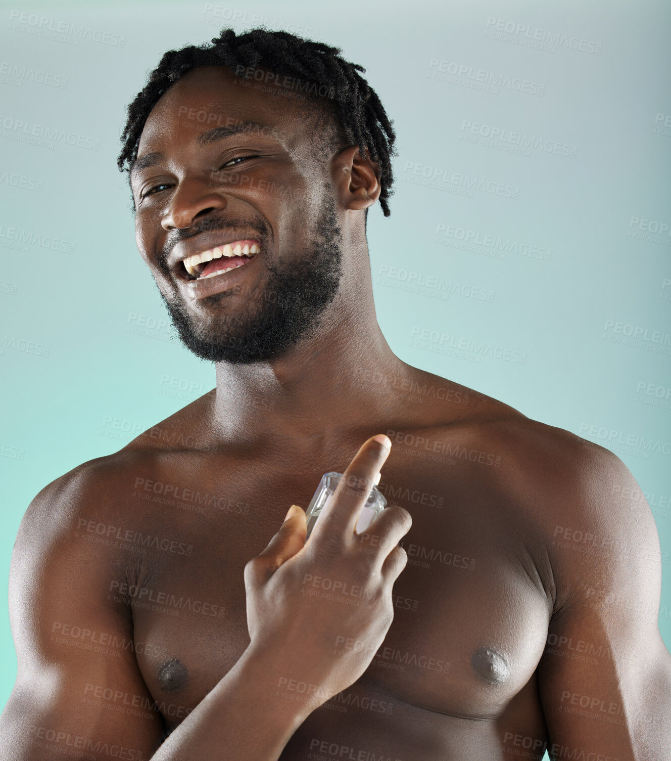 Buy stock photo Portrait, cologne and blue background with a model black man posing shirtless in studio for body spray. Perfume, product or skin with a handsome, muscular and young male standing topless on space